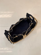 Chanel quilted handbag open-top view with gold chain trim, black