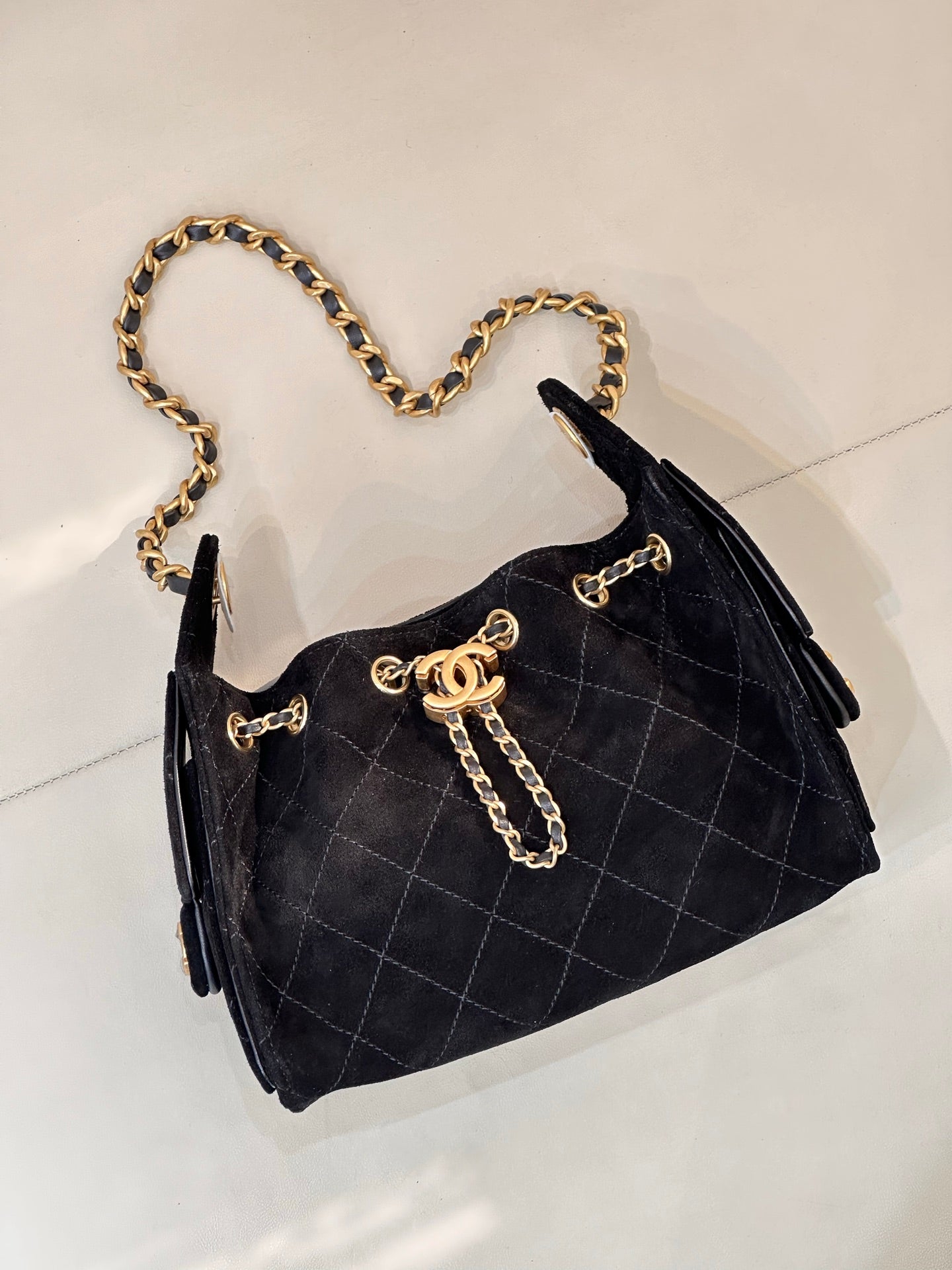 Chanel quilted handbag with gold chain strap and gold hardware accents, black