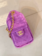 Purple Chanel mini handbag with flap, gold CC logo, and braided chain strap