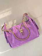 Purple quilted Chanel handbag with braided chain shoulder strap and gold CC front