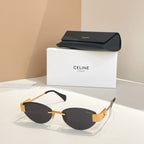 Sunglasses with gold-tone frame and dark lenses with black case