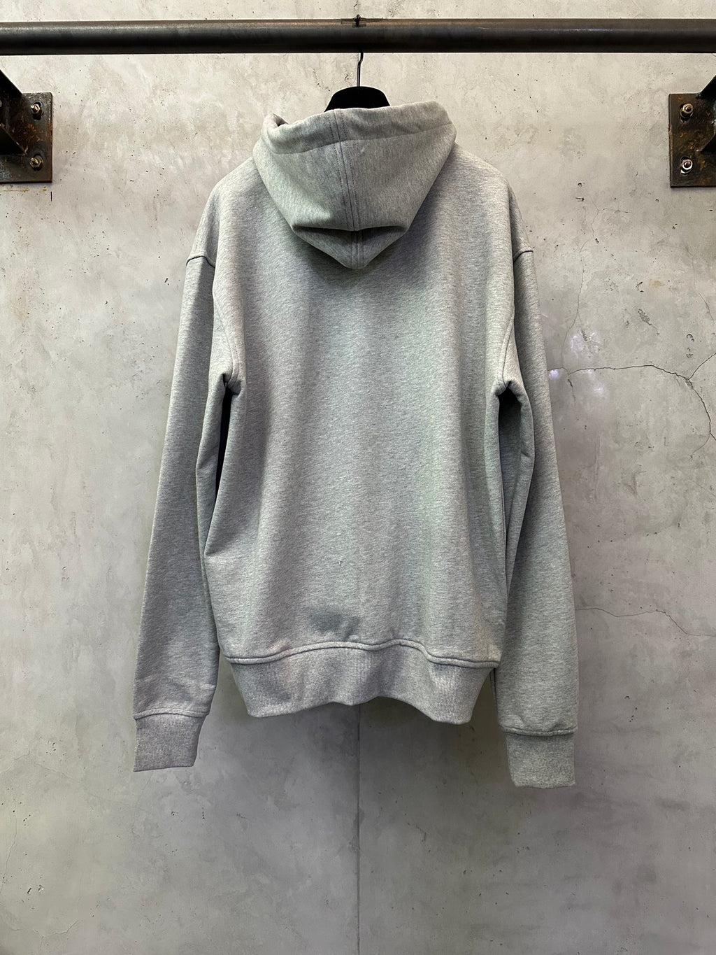 Light gray zip-up hoodie with attached hood and kangaroo-style pocket