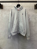 Light gray zip-up hoodie with hood, drawstrings, and front kangaroo pocket