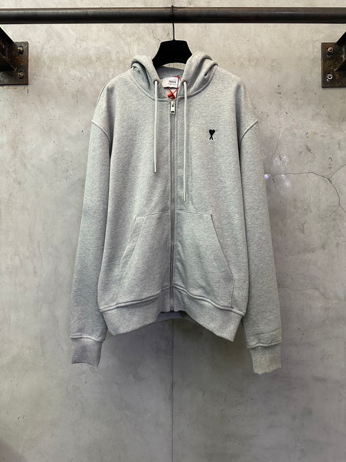 Light gray zip-up hoodie with hood, drawstrings, and front kangaroo pocket