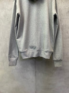 Light gray zip-up hoodie back view with ribbed hem and sleeve cuffs