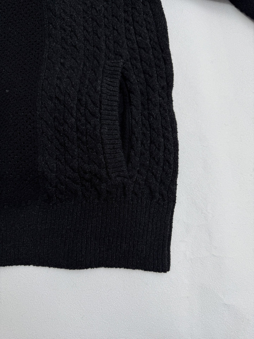 Versace black knit jacket side panel with ribbed hem and textured cable pattern