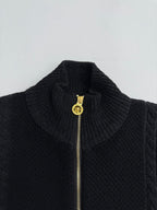 Versace black knit stand-collar jacket with gold zipper pull, textured knit detail