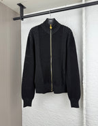 Versace black knit zip jacket with stand collar, full-length gold zipper, ribbed cuffs