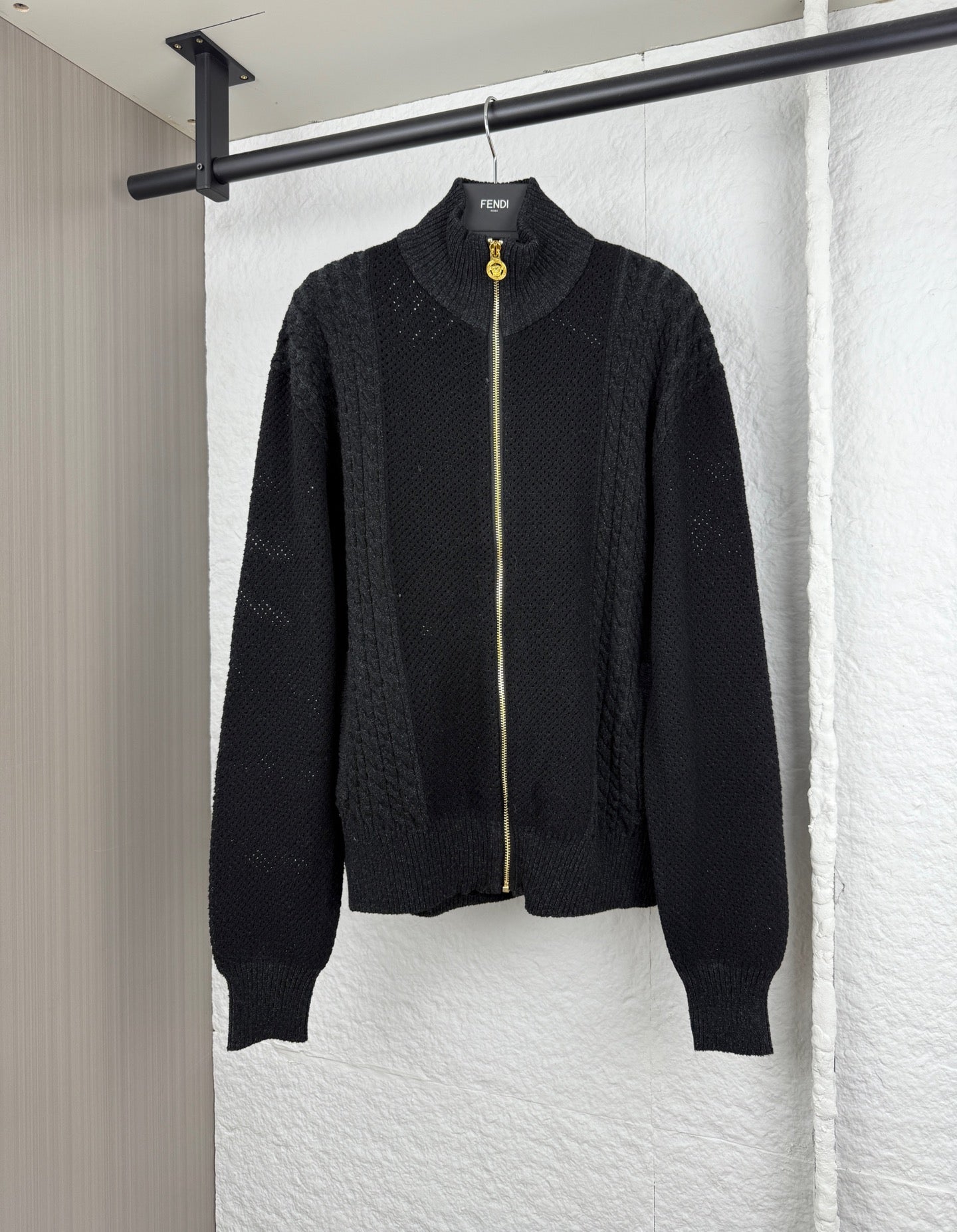 Versace black knit zip jacket with stand collar, full-length gold zipper, ribbed cuffs