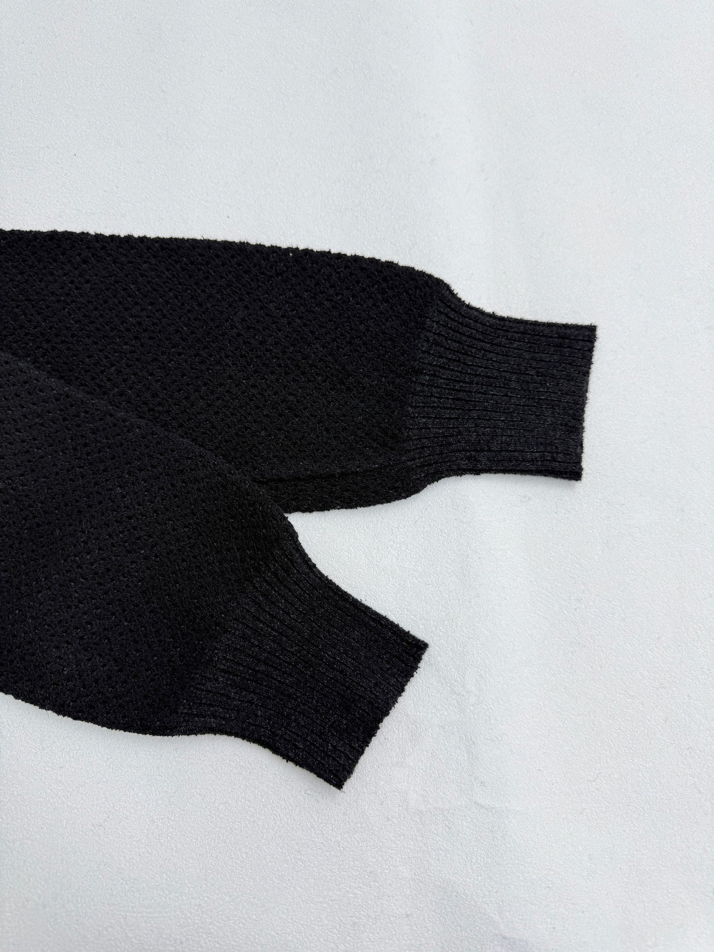 Versace black knit jacket sleeve cuffs with ribbed hem, long sleeves