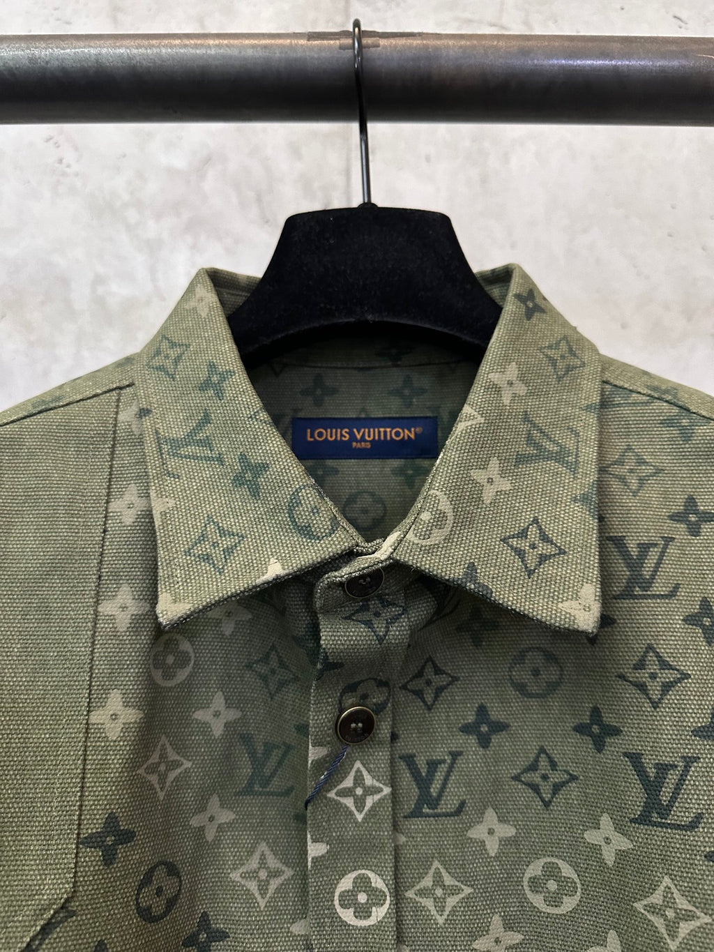 Olive green monogram shirt jacket, collar detail with Louis Vuitton label.