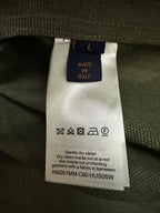 Inside care label on olive green jacket lining: made in Italy.