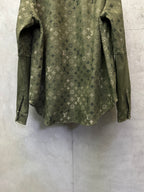 Olive green monogram long-sleeve jacket, back hem and sleeve openings visible.