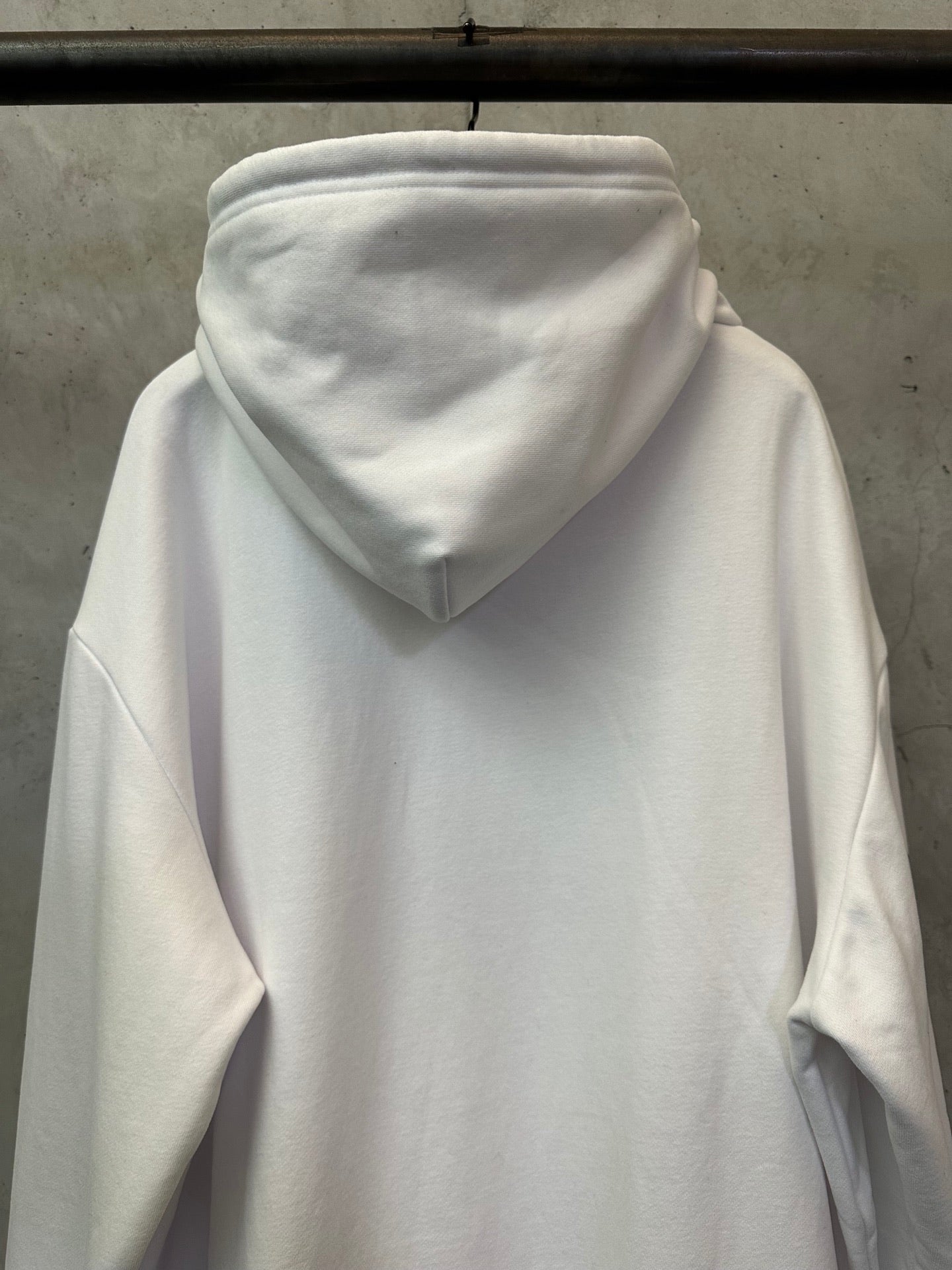 White zip-up hoodie hood and neckline with soft drawstring ties