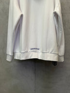 White zip-up hoodie back with small chest logo patch and ribbed hem