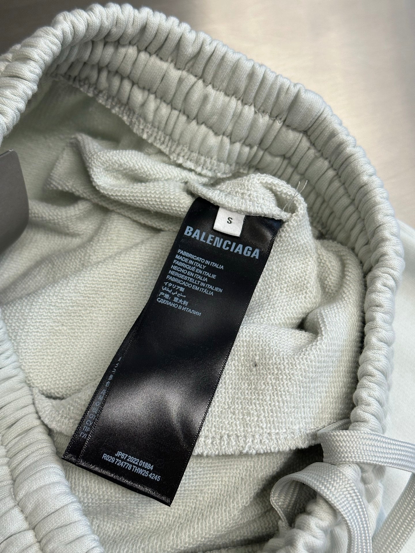 Balenciaga white pants interior with size tag and drawstring detail