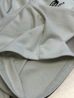 Balenciaga white pants with elastic waistband and visible front pocket seam