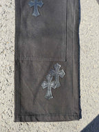 Chrome pants in dark gray with embroidered cross appliques on the leg