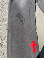 Dark gray jeans pants with dark and red cross patches on leg