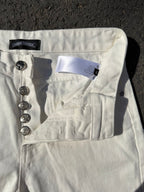 White denim pants with back yoke, patch pocket, and metal button hardware