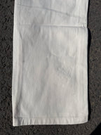 Light-colored pants with straight leg and stitched hems