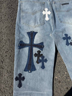 Light blue denim pants front with cross patches and coin pocket, zip fly