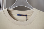 Beige Louis Vuitton T-shirt close-up of crew neck and inner brand label