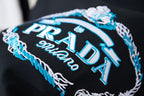 Black embroidered Prada Milano graphic with blue and white thread detail