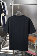 Black short-sleeve T-shirt on hanger, back view