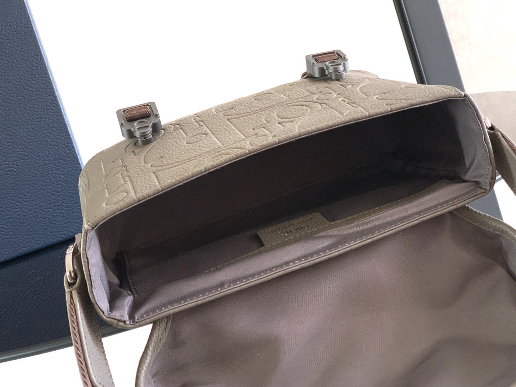 Dior taupe crossbody bag with open top and dark interior lining