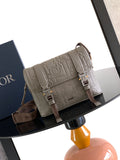 Dior embossed taupe crossbody bag with adjustable strap and front flap