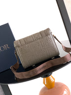 Dior embossed taupe crossbody bag with long strap and flap front