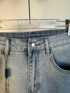 Light blue denim waistband with decorative ring detail and belt loops