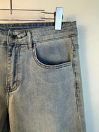 Light blue denim pants with curved front pocket and belt loops