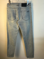 Light blue denim pants back view with two rear pockets