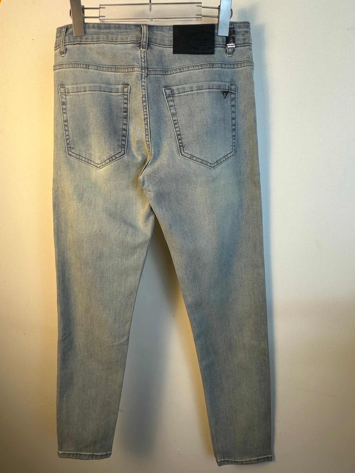 Light blue denim pants back view with two rear pockets
