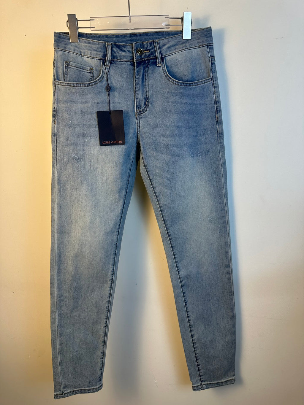 Louis Vuitton light blue denim pants, straight leg, five-pocket style, belt loops