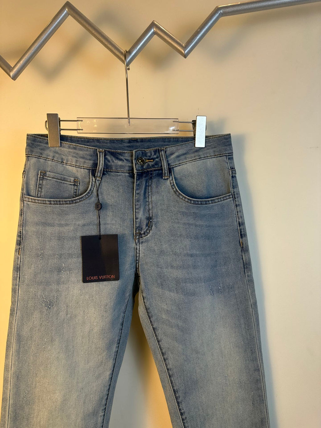 Louis Vuitton denim pants, light blue wash, five-pocket design, belt loops