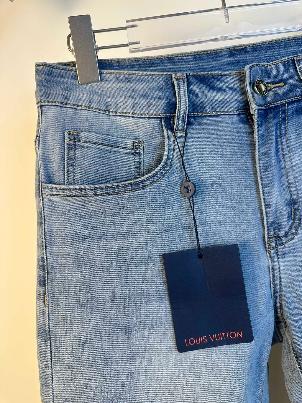Louis Vuitton denim pants back view, patch back pockets and logo tag