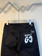 Black pants on hanger, front pockets, with white GG69 logo patch
