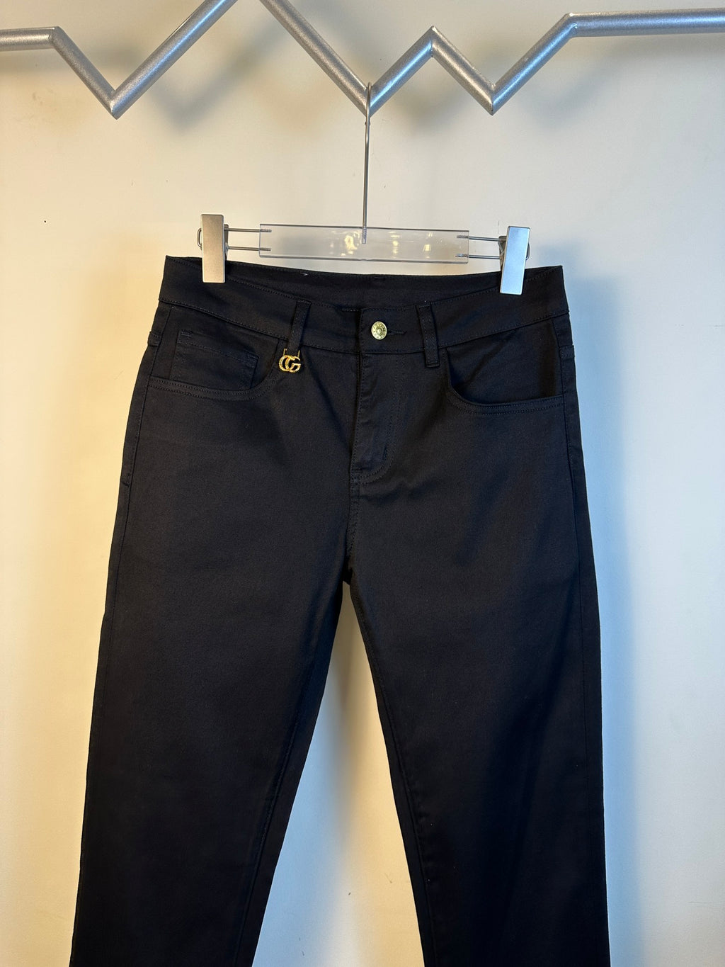 Gucci pants with black denim, button waistband, and gold GG emblem