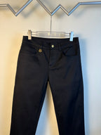 Gucci pants with black denim, button waistband, and gold GG emblem