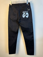 Black pants with two front pockets and white GG69 graphic on pocket