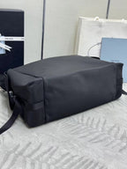 Prada bag in dark nylon with structured back panel and shoulder strap
