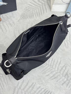 Prada black nylon crossbody bag with zippered opening and metal D-ring strap