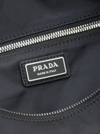 Prada Made in Italy label on black nylon zipper pocket