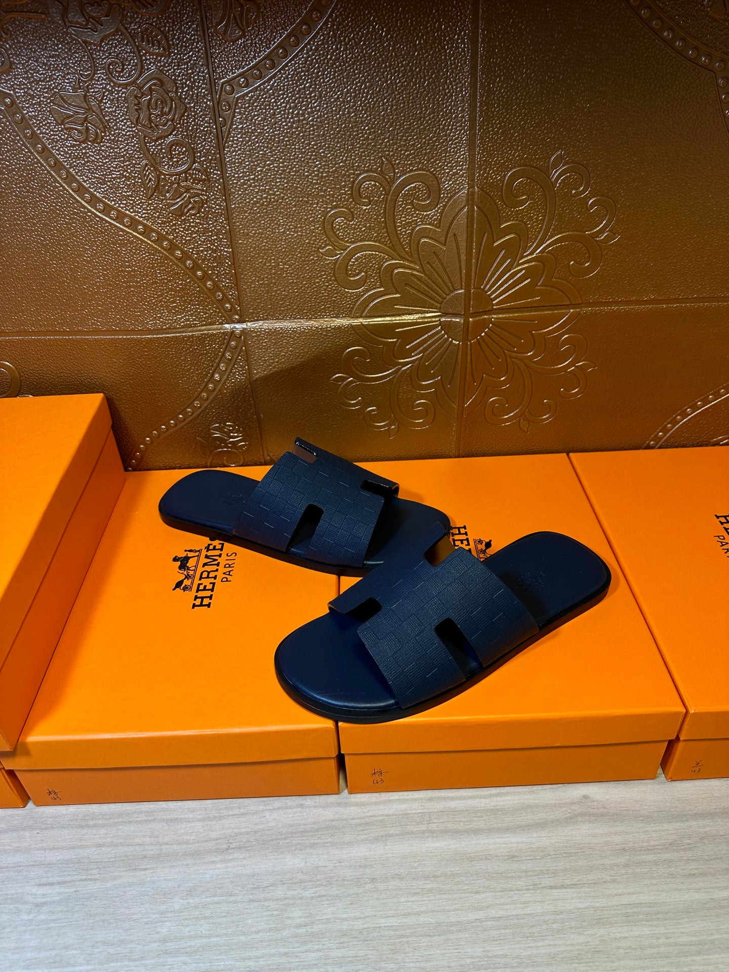 Blue slide sandals with cross strap design and contoured sole