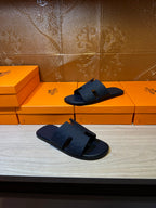 Blue slide sandals pair, one angled forward and one on display