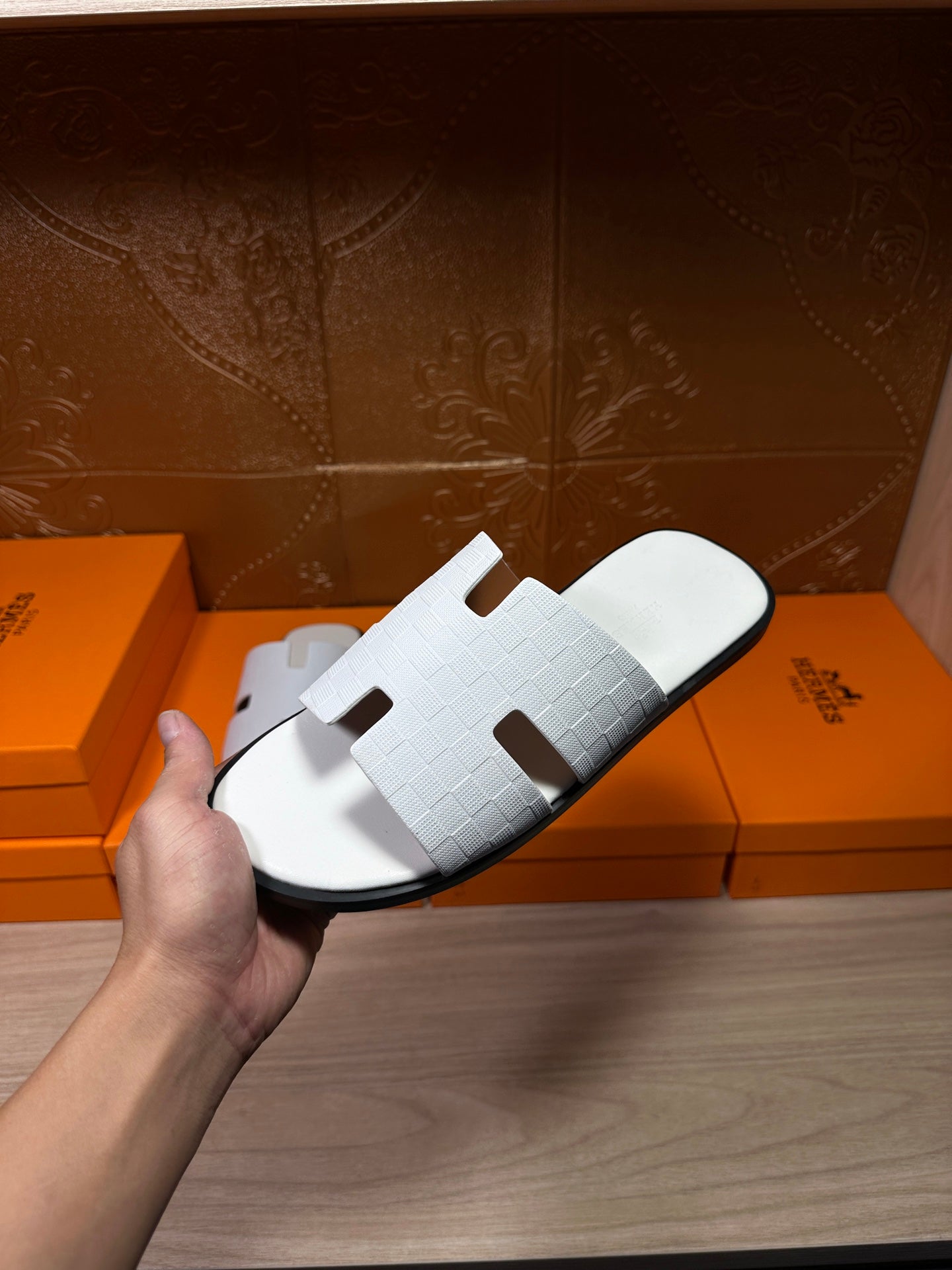 Hermes slide sandals in white leather, textured strap with rectangular cutouts