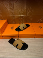 Hermes beige and black slide sandals, open toe on top of box